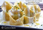 Tortelli di cavolo nero al limone con salsina di nocciole profumata all'arancia